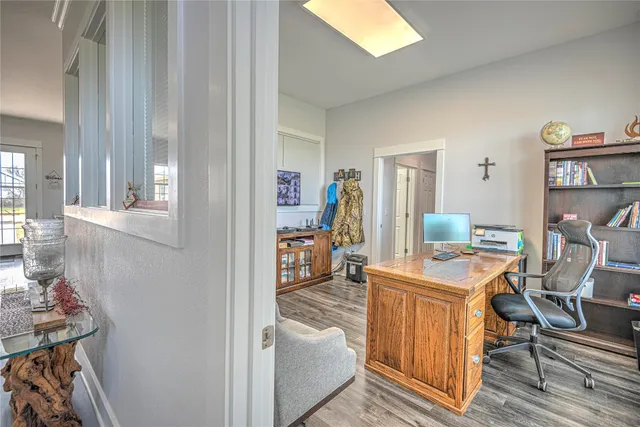 a living room with furniture and a dining table