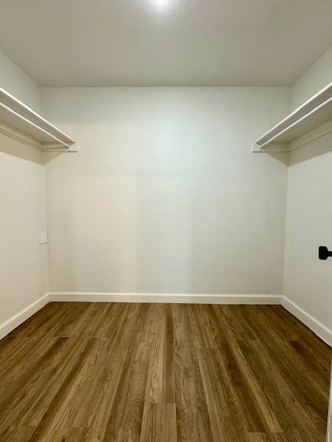 2250 Hunter Drive Pea Ridge, AR 72751 - Photo 14 of 21 Wood-finish flooring, white walls, and built-in shelving