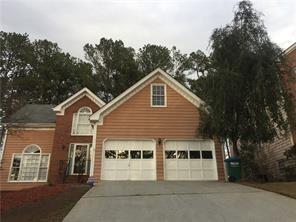 a view of a house with a yard and balcony