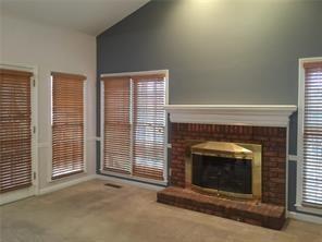 325 Rams Way Tucker, GA 30084 - Photo 2 of 12 a view of an empty room with a fireplace