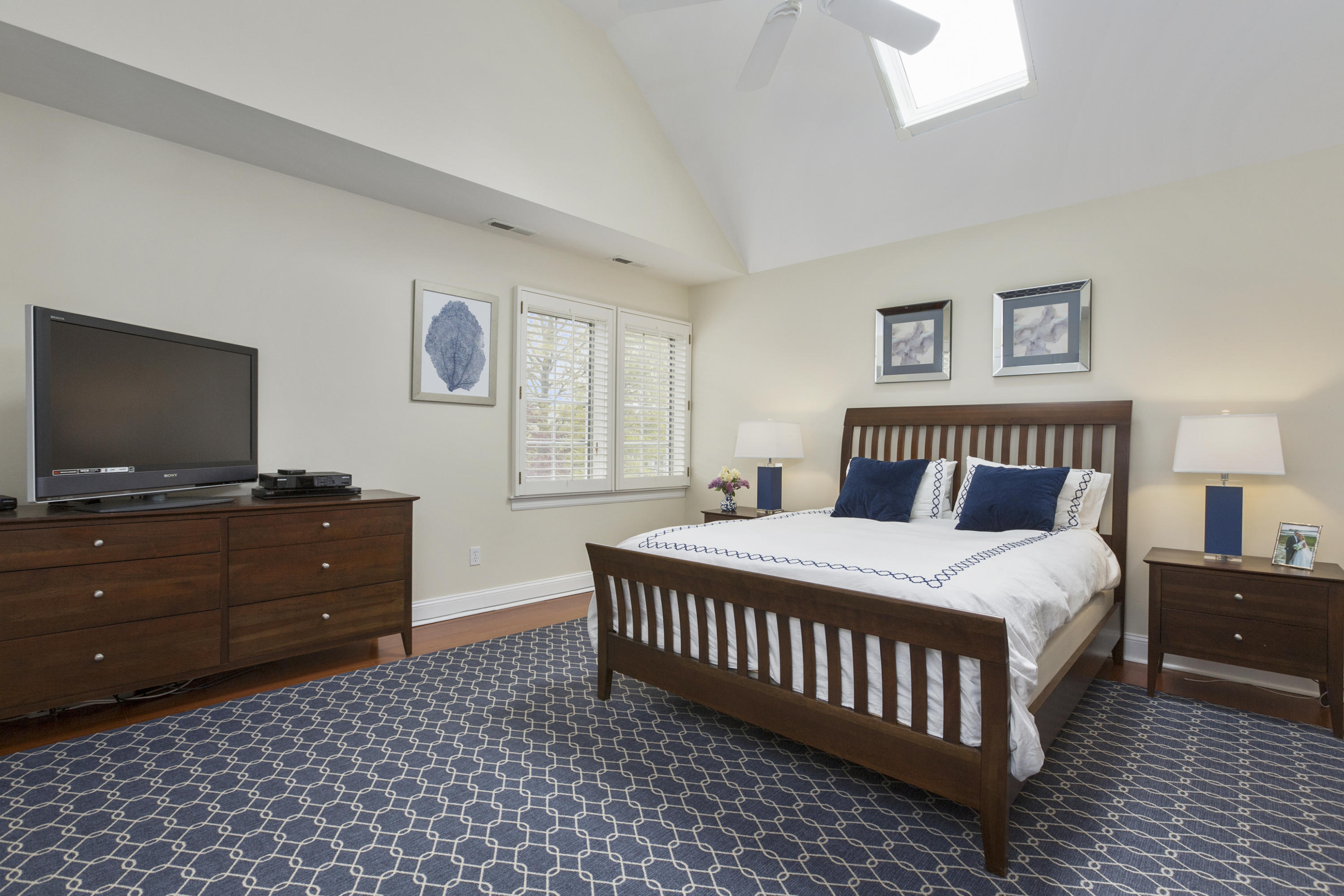 39 Hale Lane Darien, CT 06820 - Photo 11 of 19 a bedroom with a bed and a flat screen tv