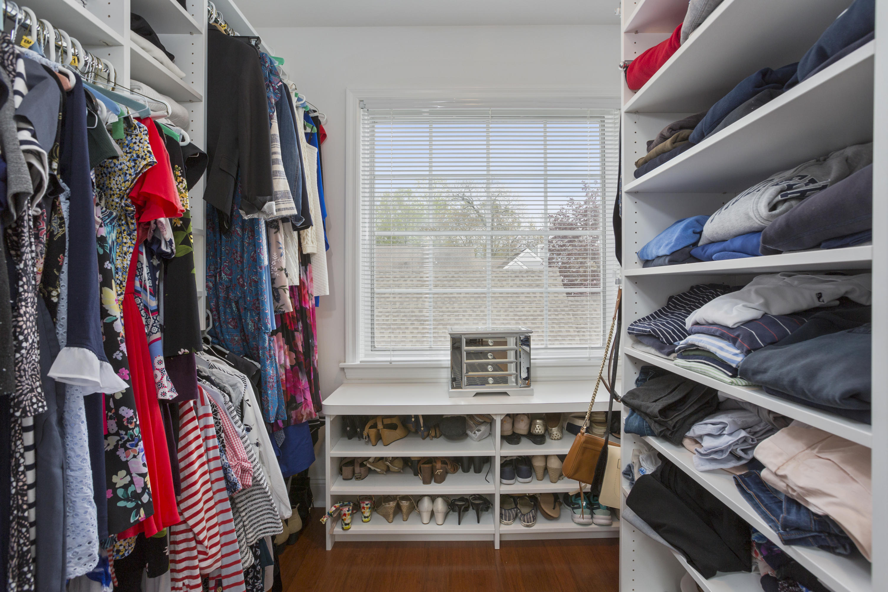 39 Hale Lane Darien, CT 06820 - Photo 13 of 19 a view of walk in closet with clothes and shoes