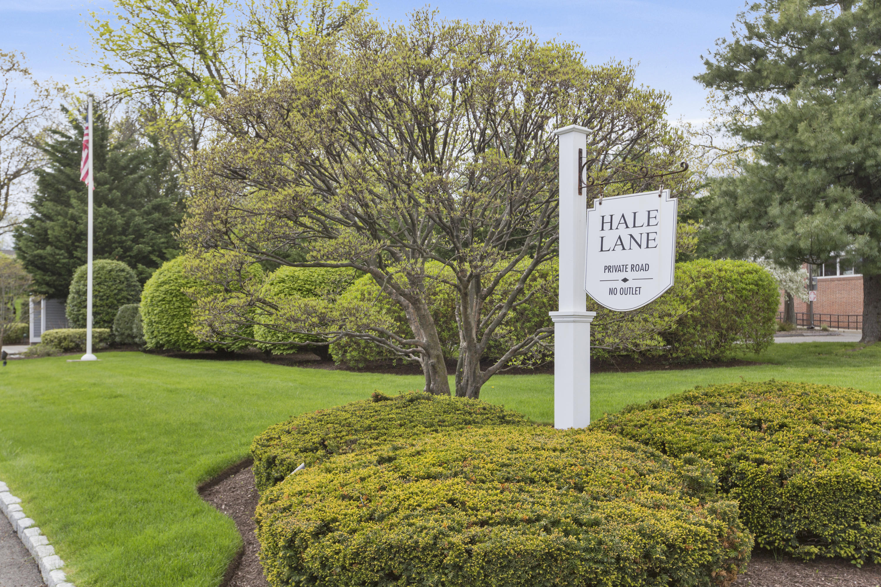39 Hale Lane Darien, CT 06820 - Photo 18 of 19 a sign board with tall trees