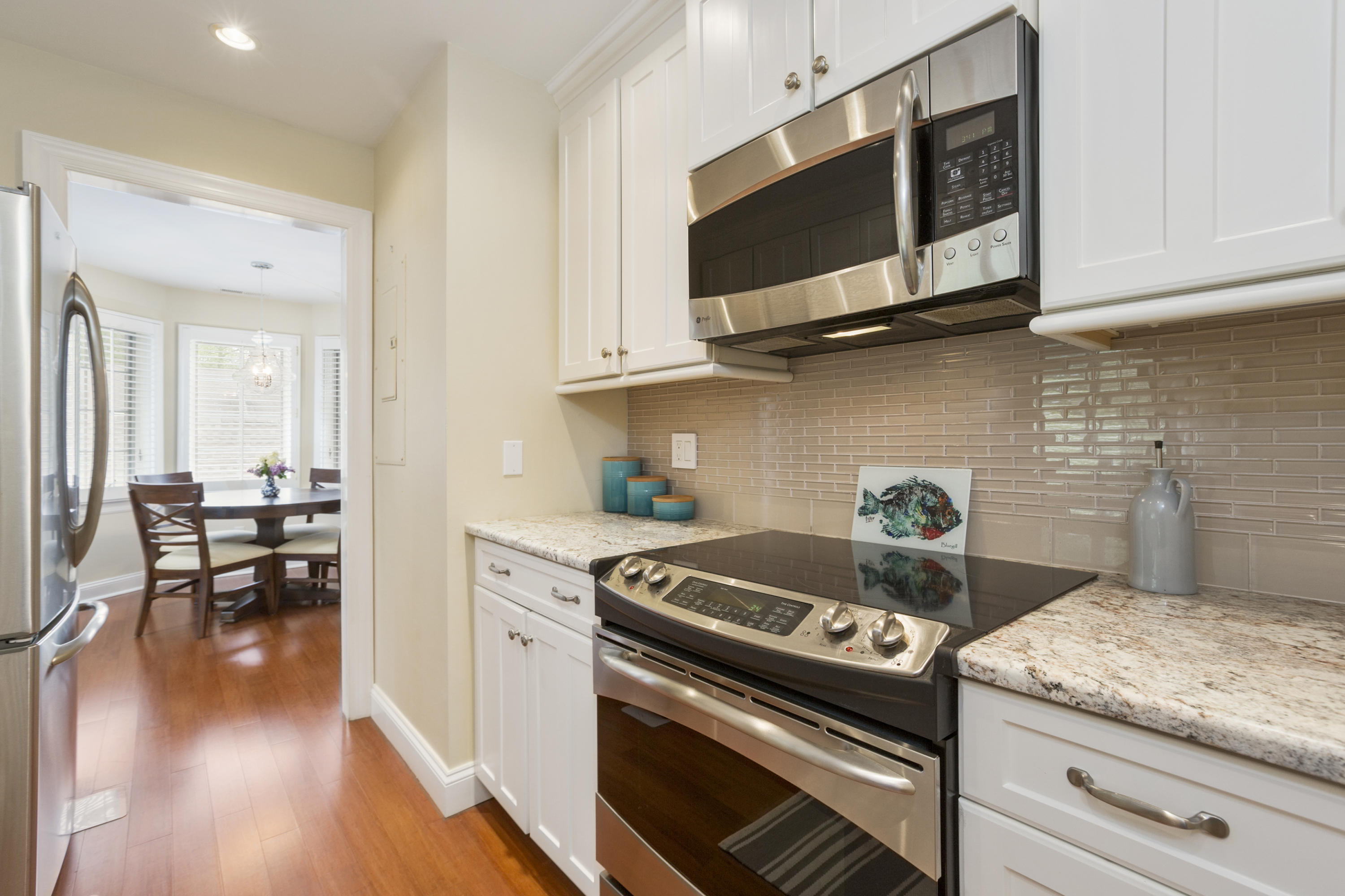 39 Hale Lane Darien, CT 06820 - Photo 9 of 19 a kitchen with stainless steel appliances granite countertop a stove and a microwave