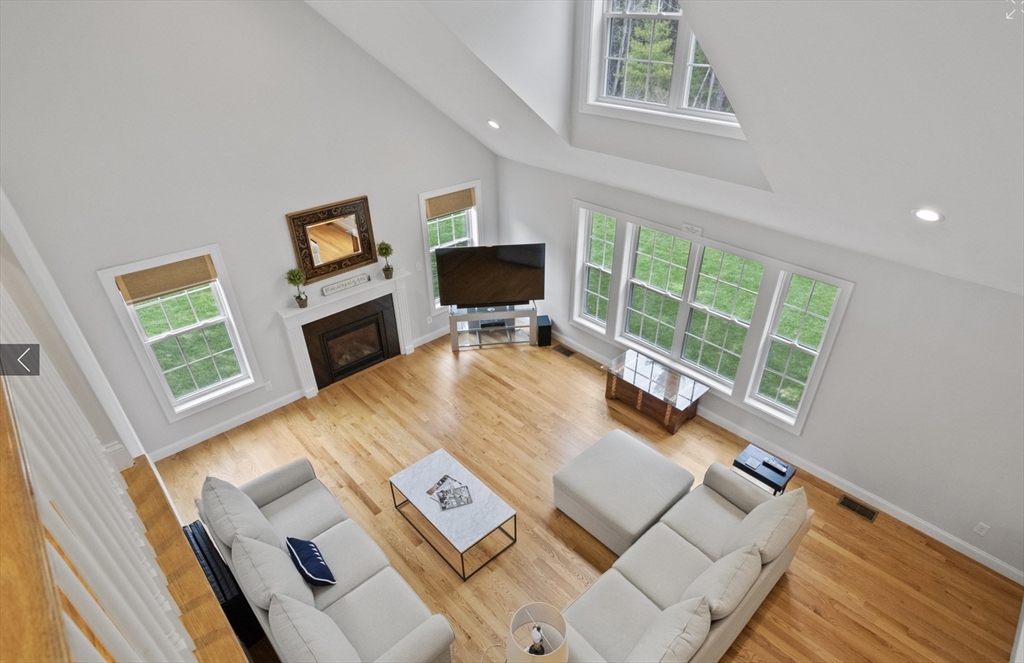 3 Pond Circle Pepperell, MA 01463 - Photo 17 of 33 a living room with furniture and a flat screen tv