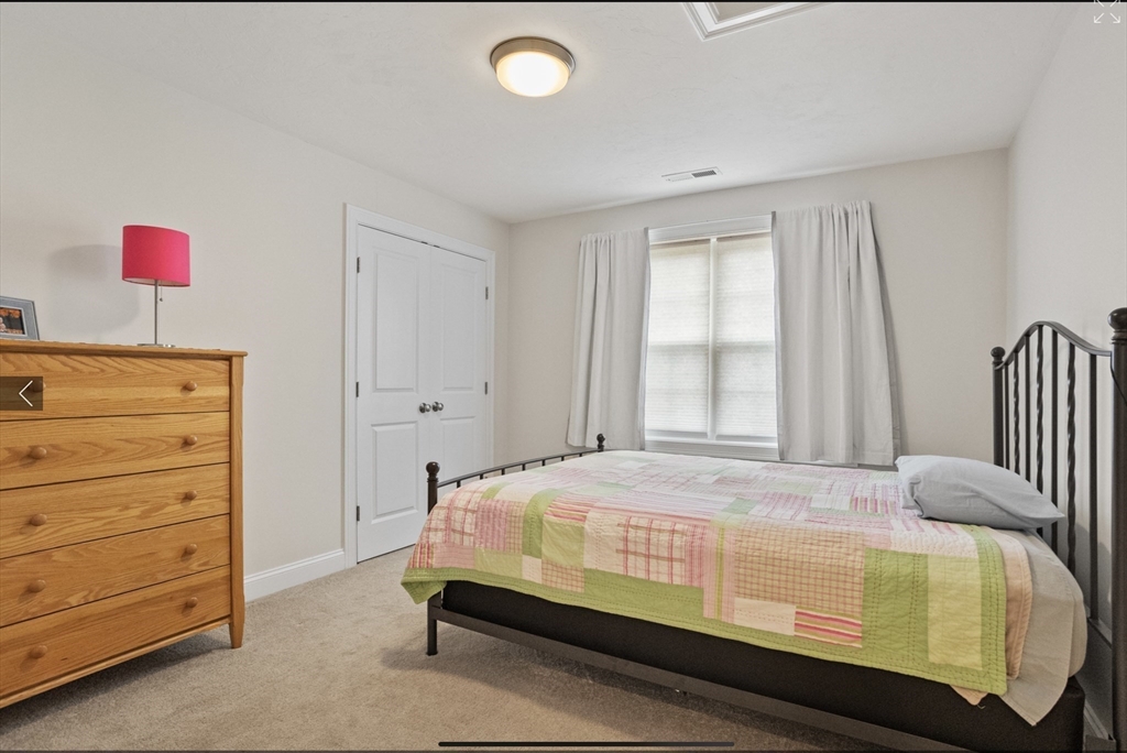 3 Pond Circle Pepperell, MA 01463 - Photo 22 of 33 a bedroom with a bed and a window