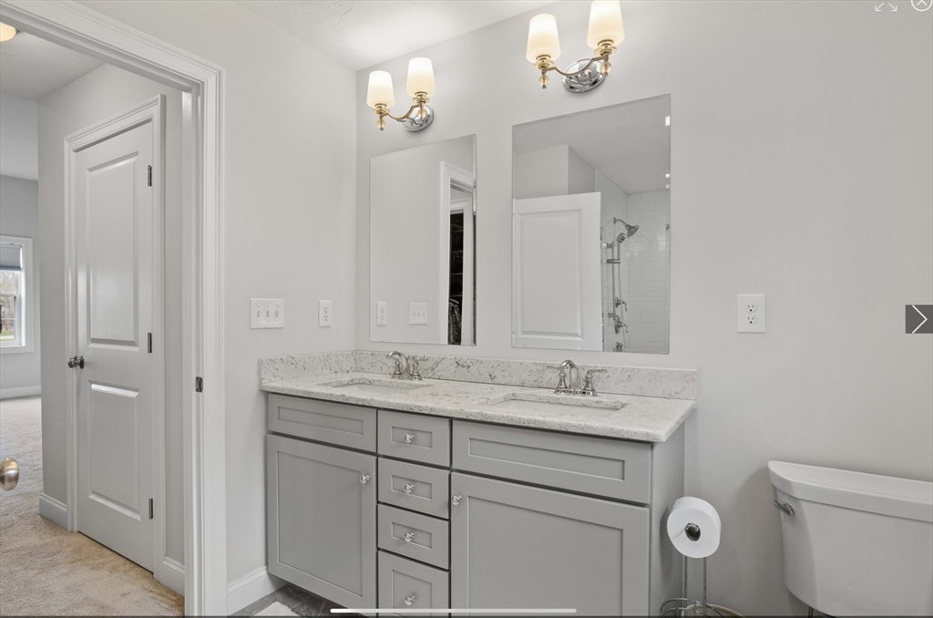 3 Pond Circle Pepperell, MA 01463 - Photo 24 of 33 a bathroom with a granite countertop sink a toilet and a mirror
