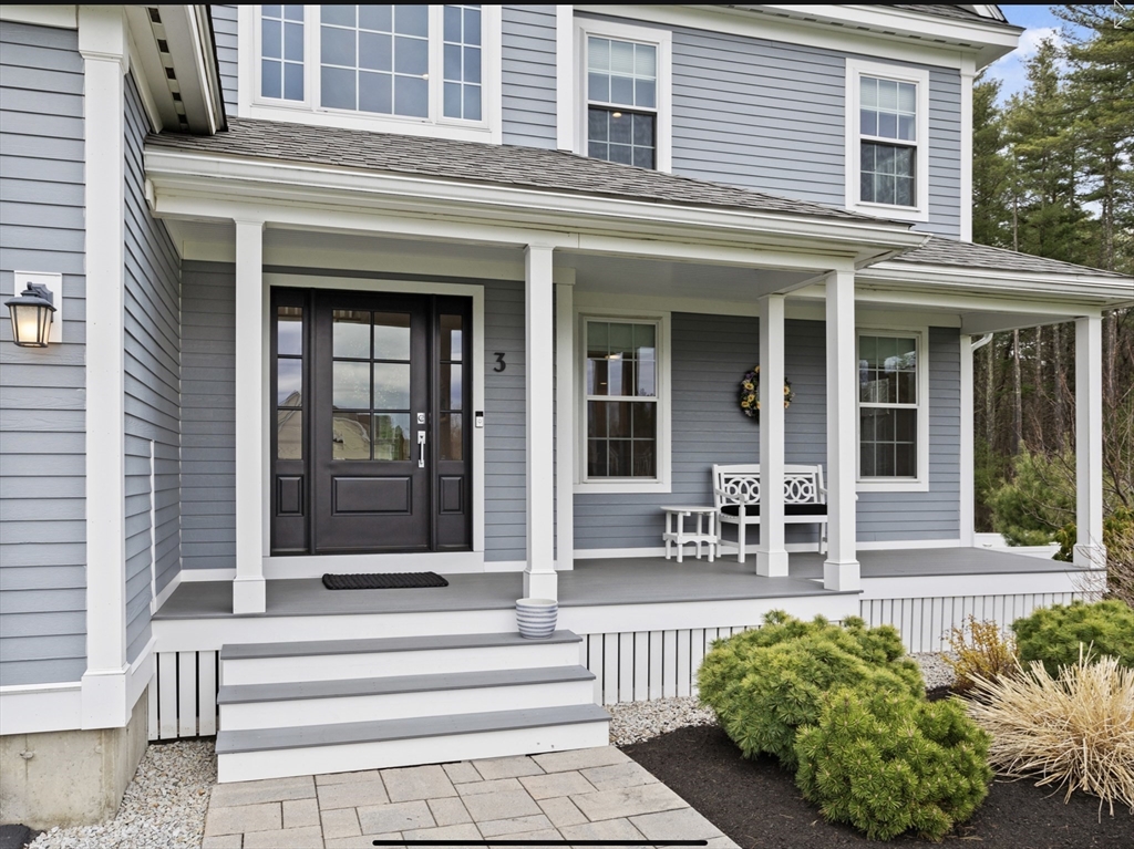 3 Pond Circle Pepperell, MA 01463 - Photo 3 of 33 a front view of a house with outdoor seating and plants