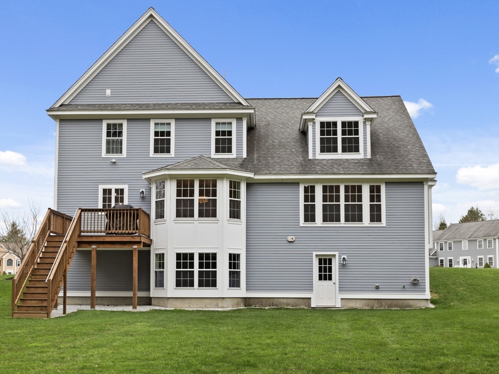 3 Pond Circle Pepperell, MA 01463 - Photo 31 of 33 a front view of a house with a yard