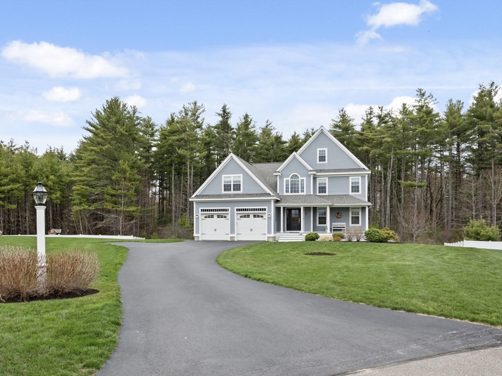 3 Pond Circle Pepperell, MA 01463 - Photo 4 of 33 a front view of a house with a yard