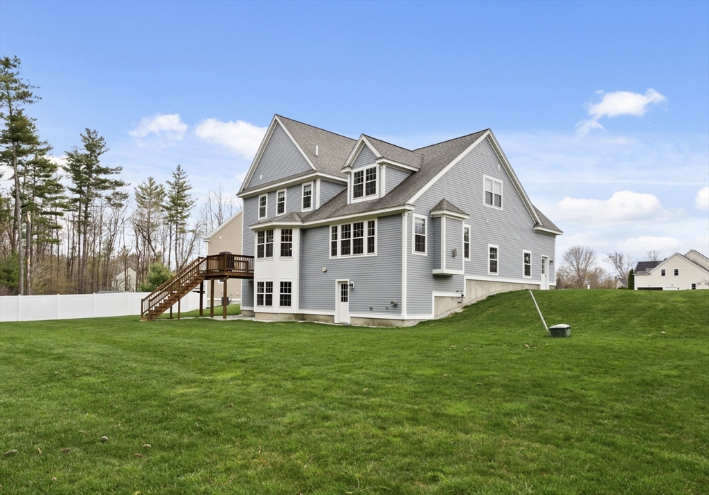 3 Pond Circle Pepperell, MA 01463 - Photo 5 of 33 a front view of a house with garden