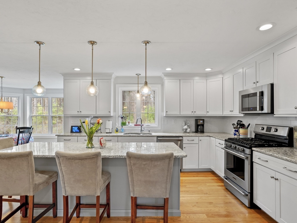 3 Pond Circle Pepperell, MA 01463 - Photo 7 of 33 a kitchen with counter top space appliances cabinets and furniture