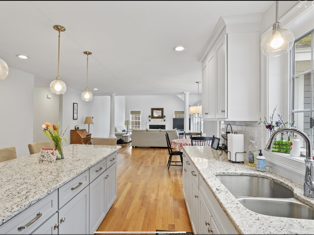 3 Pond Circle Pepperell, MA 01463 - Photo 8 of 33 a large kitchen with granite countertop a sink and cabinets