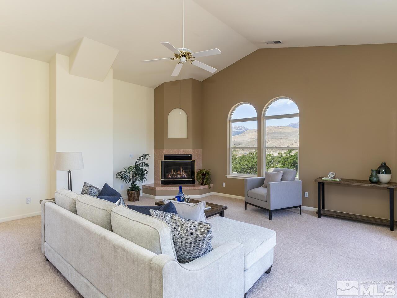 1090 Reese Way Reno, NV 89521 - Photo 13 of 33 a living room with furniture and a large window