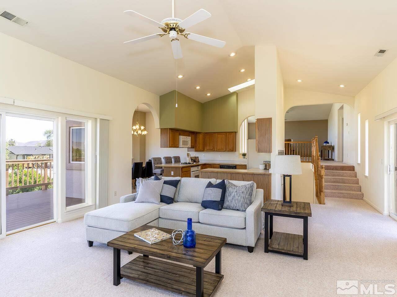 1090 Reese Way Reno, NV 89521 - Photo 14 of 33 a living room with furniture and a large window