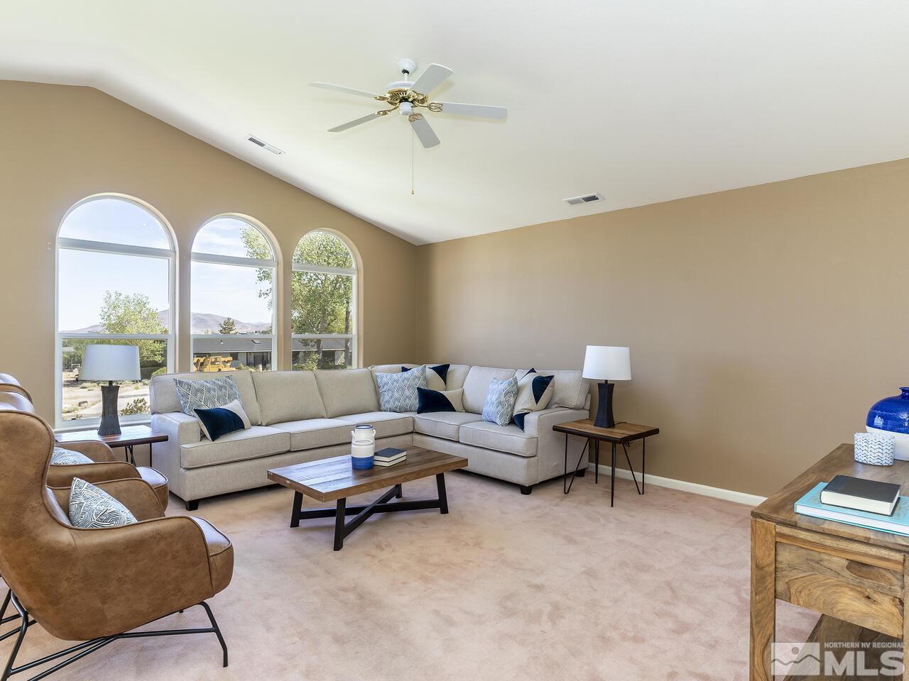 1090 Reese Way Reno, NV 89521 - Photo 15 of 33 a living room with furniture and a large window