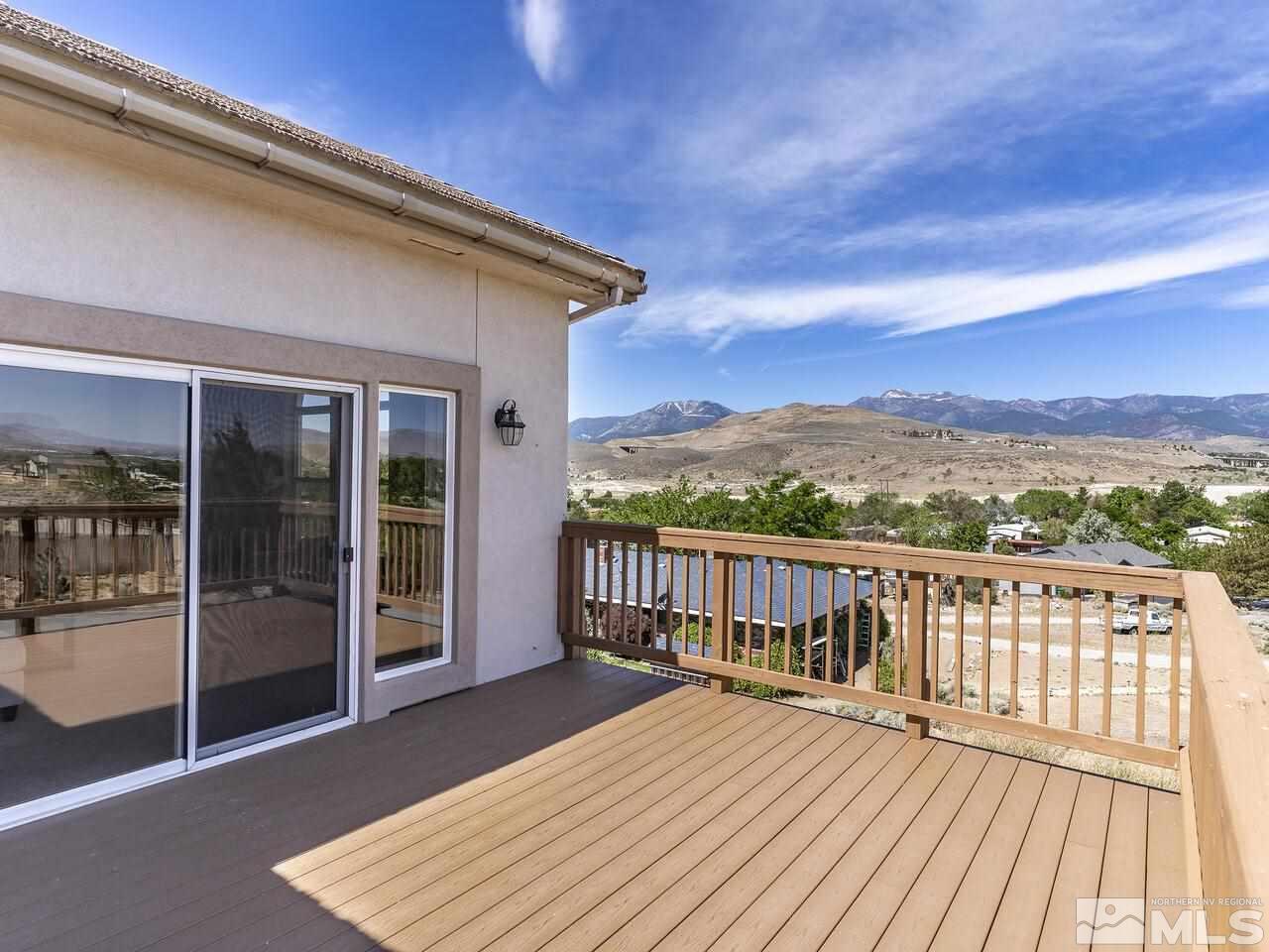 1090 Reese Way Reno, NV 89521 - Photo 2 of 33 a view of a balcony with wooden floor and city view
