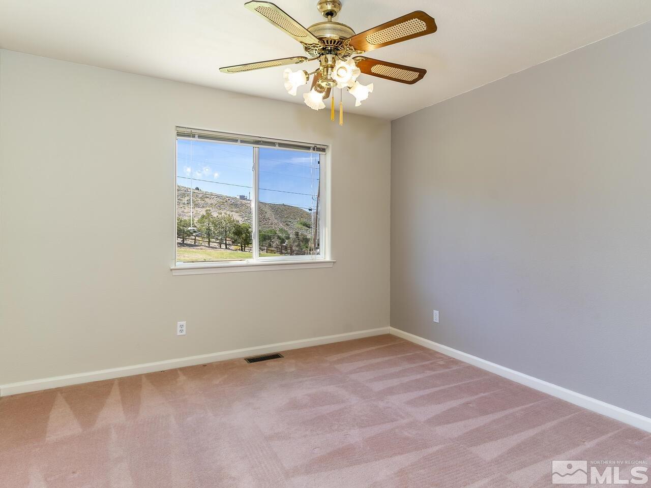 1090 Reese Way Reno, NV 89521 - Photo 24 of 33 a view of an empty room with a window