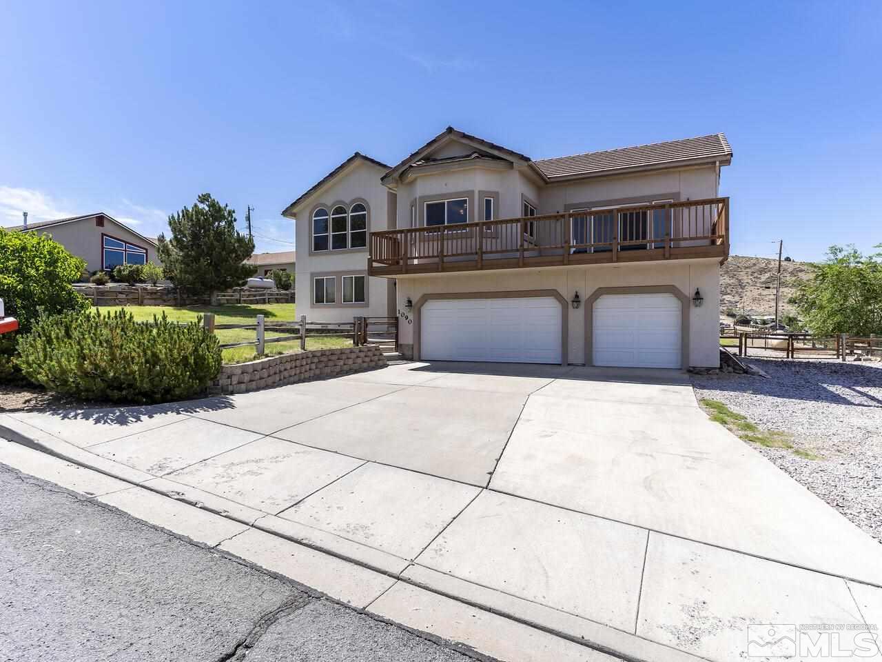 1090 Reese Way Reno, NV 89521 - Photo 27 of 33 a front view of a house with a garden