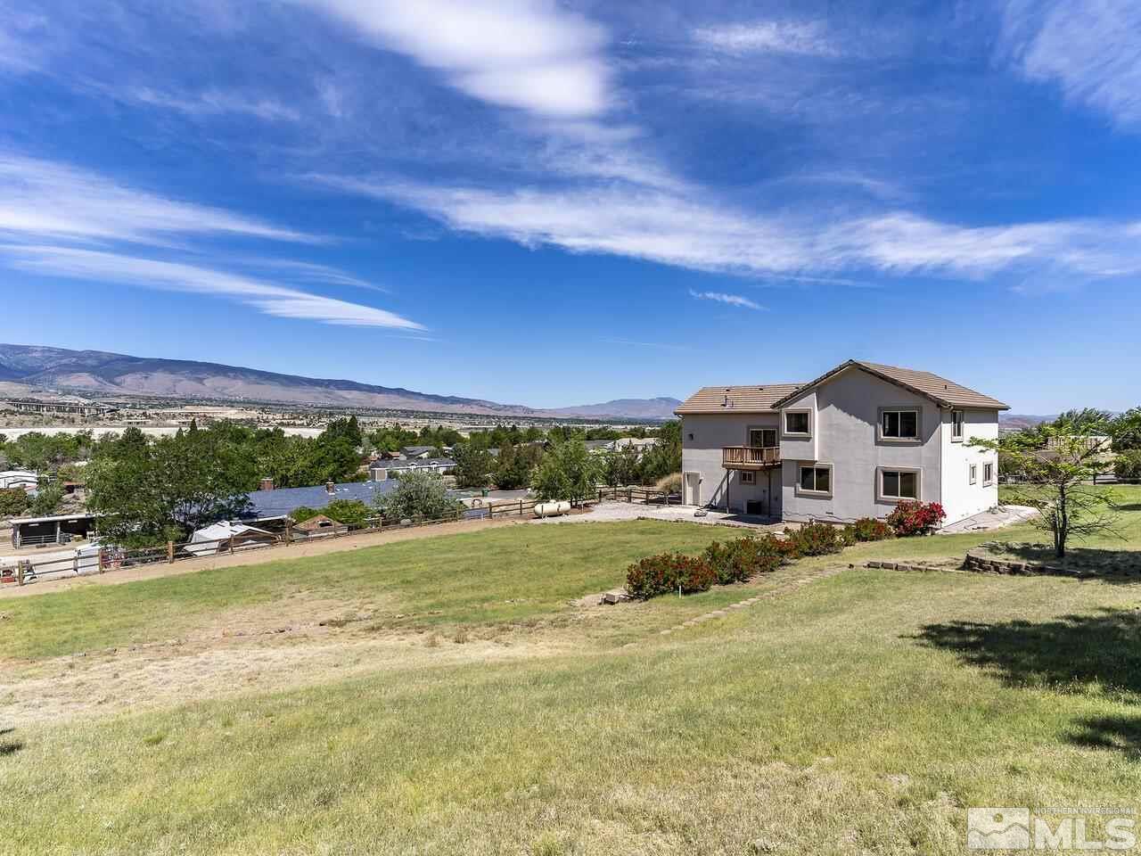 1090 Reese Way Reno, NV 89521 - Photo 5 of 33 a view of a house with a big yard
