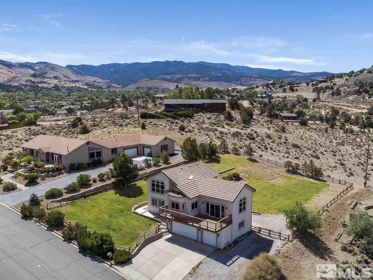 1090 Reese Way Reno, NV 89521 - Photo 7 of 33 an aerial view of a house with a mountain