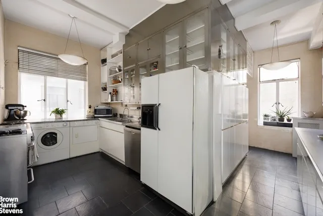 a bathroom with a granite countertop bathtub shower sink and toilet