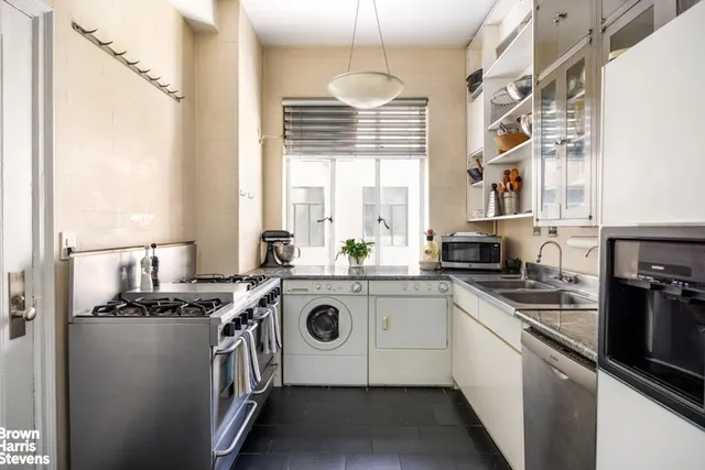 a white refrigerator freezer sitting inside of a kitchen