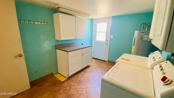 a kitchen with a refrigerator and a sink