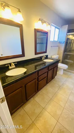 a bathroom with a glass shower door