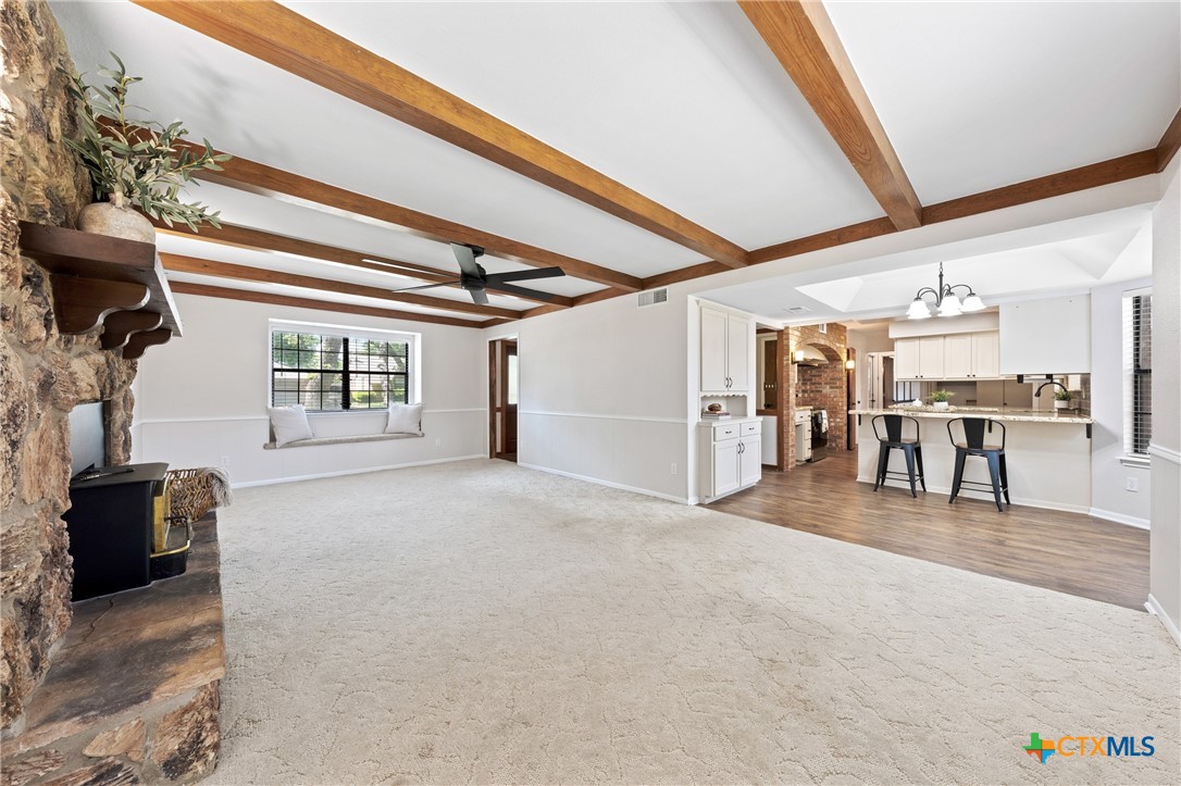 1903 North Harding Avenue Cameron, TX 76520 - Photo 11 of 44 Living Area 1: Orignal Wooden Beams and wood burning stove.