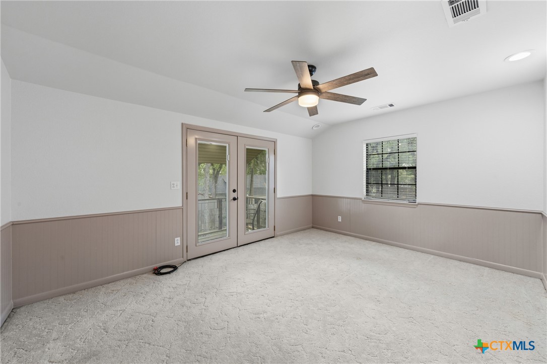 1903 North Harding Avenue Cameron, TX 76520 - Photo 24 of 44 Primary Bedroom showing doors leading to the balcony.
