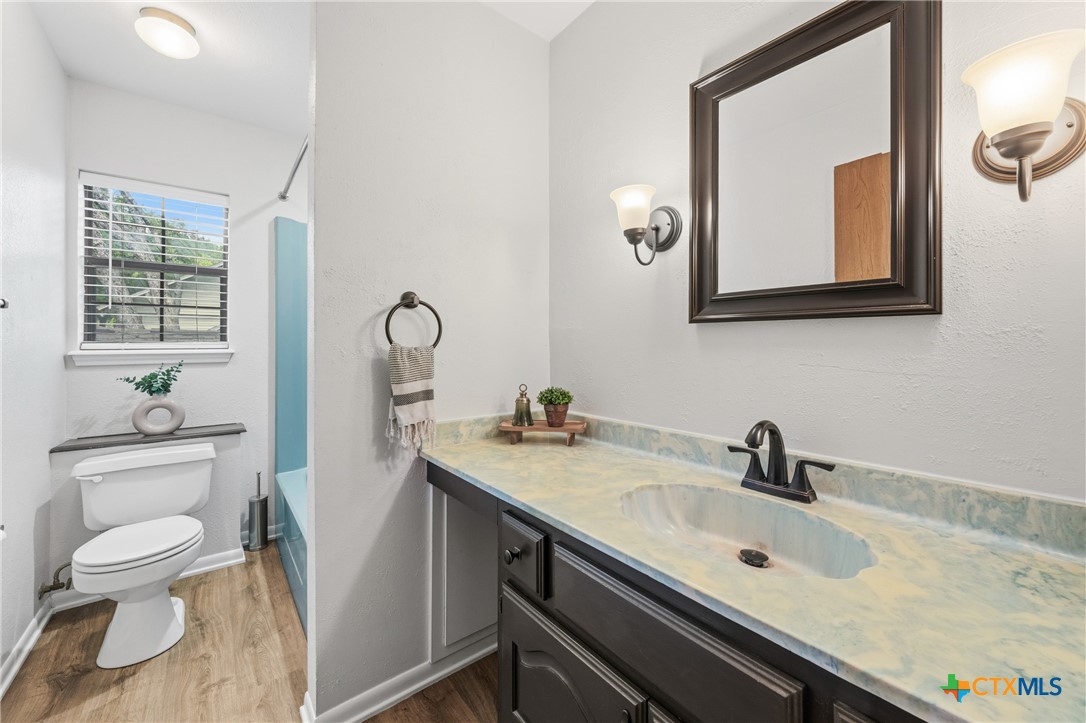 1903 North Harding Avenue Cameron, TX 76520 - Photo 32 of 44 Secondary Bathroom. Laundry chute located behind toilet and leads to downstairs bathroom!
