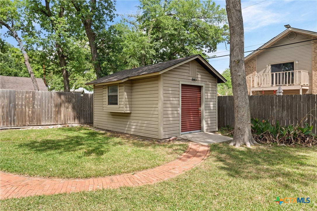 1903 North Harding Avenue Cameron, TX 76520 - Photo 38 of 44 Storage Shed with Rollup Door