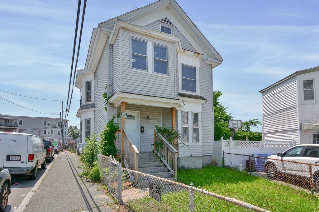 10 Holly Street Lawrence, MA 01841 - Photo 1 of 32 a front view of a house with a yard