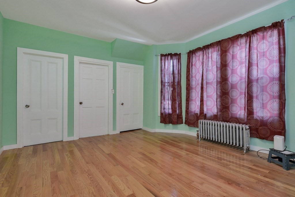 10 Holly Street Lawrence, MA 01841 - Photo 12 of 32 a view of a room with staircase and door