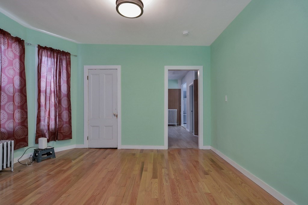 10 Holly Street Lawrence, MA 01841 - Photo 14 of 32 wooden floor in a room