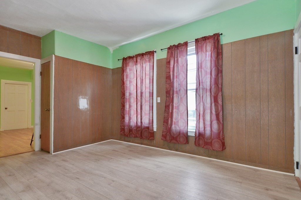 10 Holly Street Lawrence, MA 01841 - Photo 16 of 32 an empty room with windows and closet area