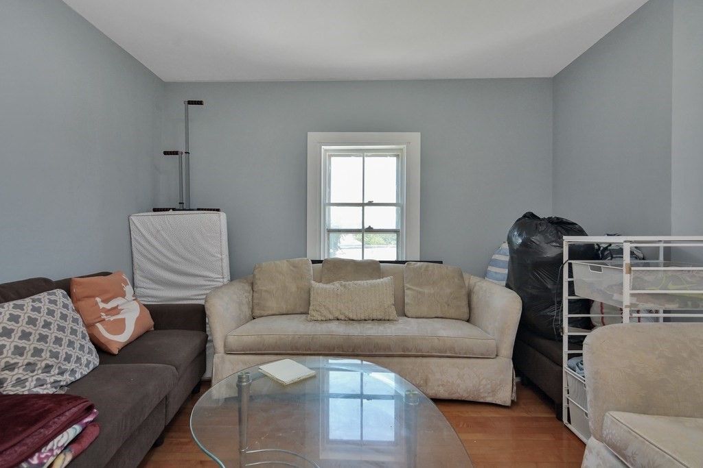 10 Holly Street Lawrence, MA 01841 - Photo 24 of 32 a living room with furniture and a window
