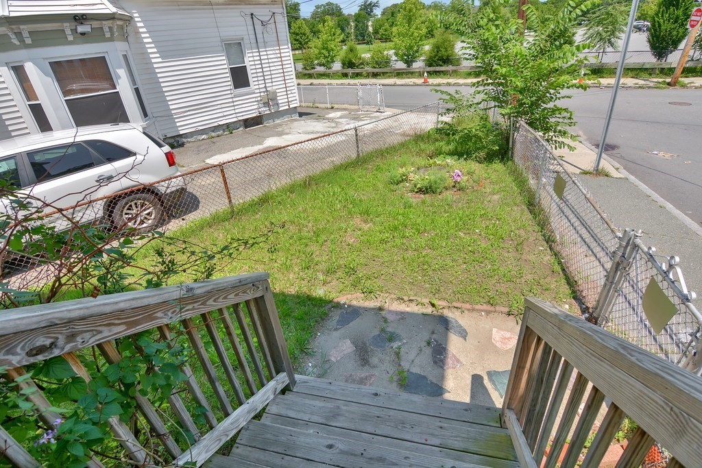 10 Holly Street Lawrence, MA 01841 - Photo 30 of 32 a view of a backyard with a garden