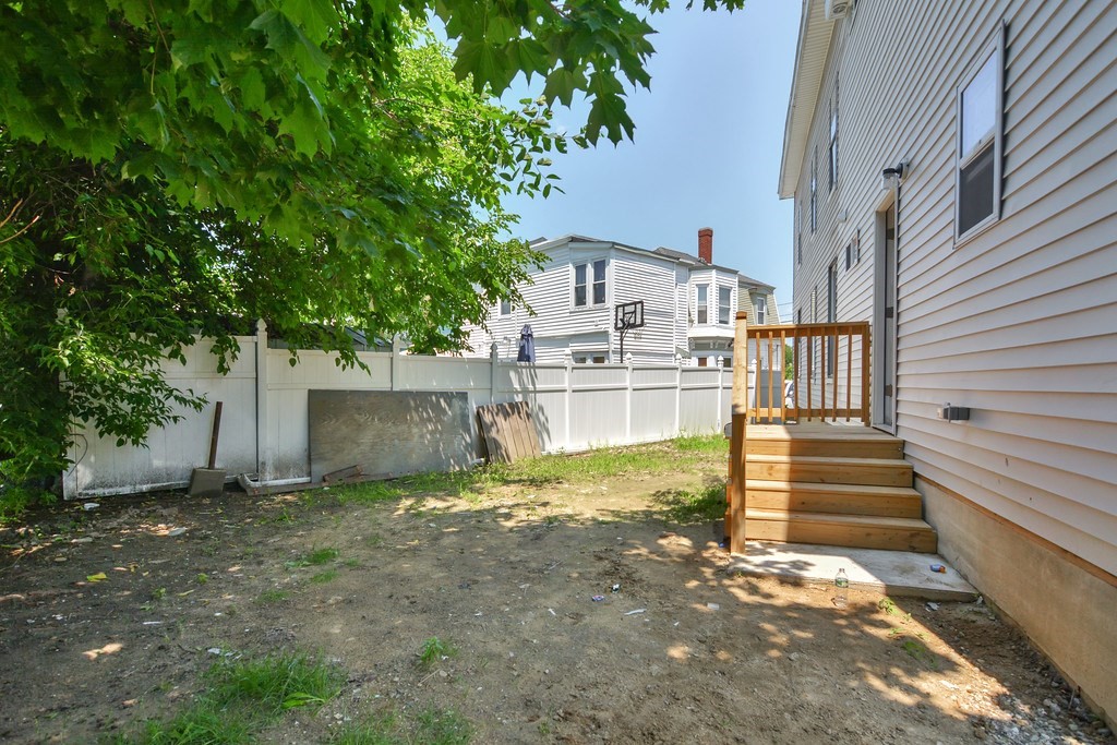 10 Holly Street Lawrence, MA 01841 - Photo 32 of 32 a view of a house with a yard