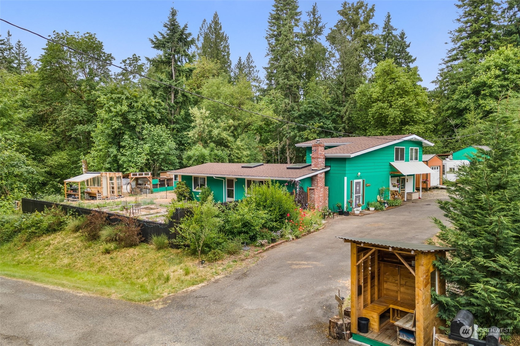 19606 Northwest 11th Avenue Ridgefield, WA 98642 - Photo 2 of 32 an aerial view of a house with swimming pool and patio