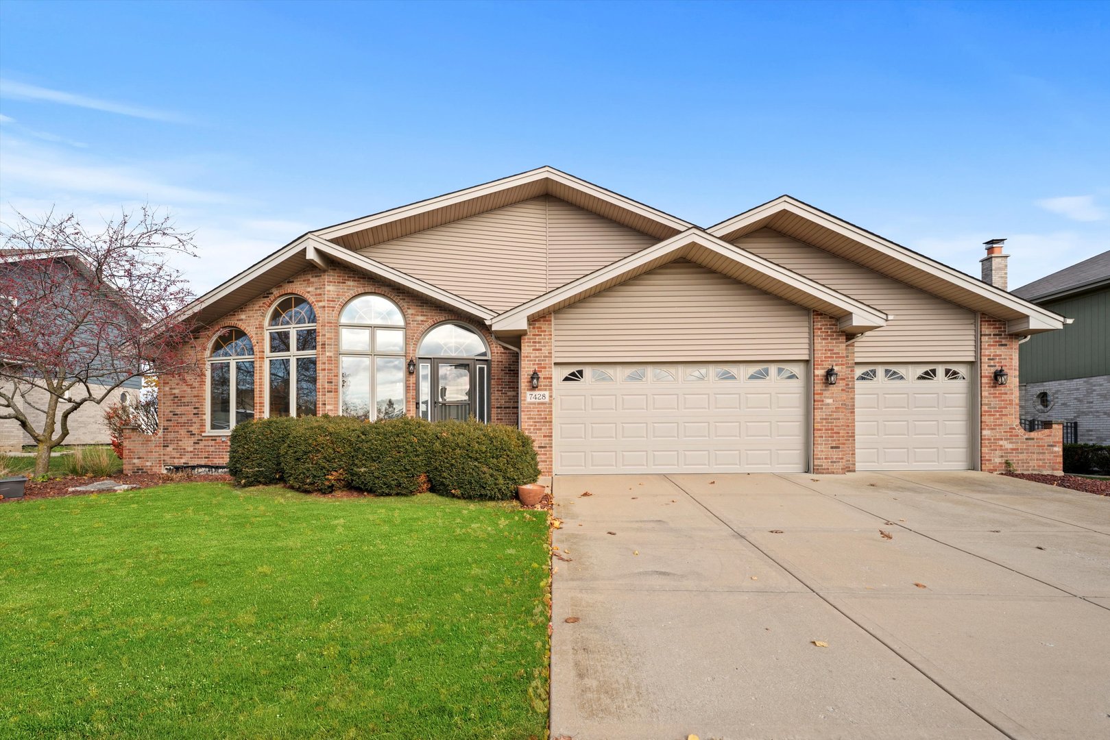 a front view of house with yard and green space