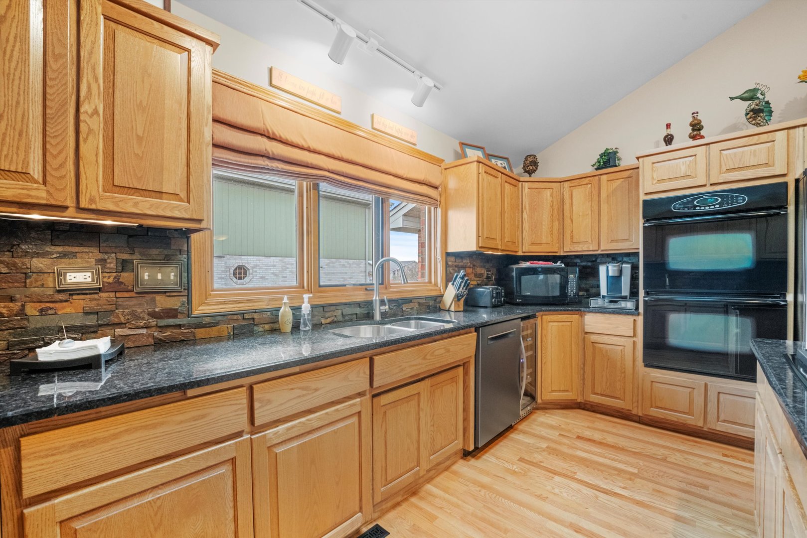 7428 Ridgefield Lane Tinley Park, IL 60487 - Photo 13 of 43 a kitchen with granite countertop a sink and cabinets