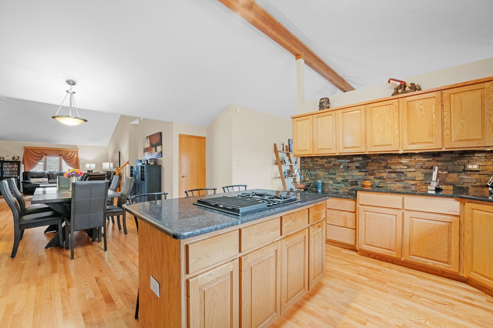 7428 Ridgefield Lane Tinley Park, IL 60487 - Photo 14 of 43 a kitchen with stainless steel appliances granite countertop a stove top oven a sink dishwasher and white cabinets with wooden floor