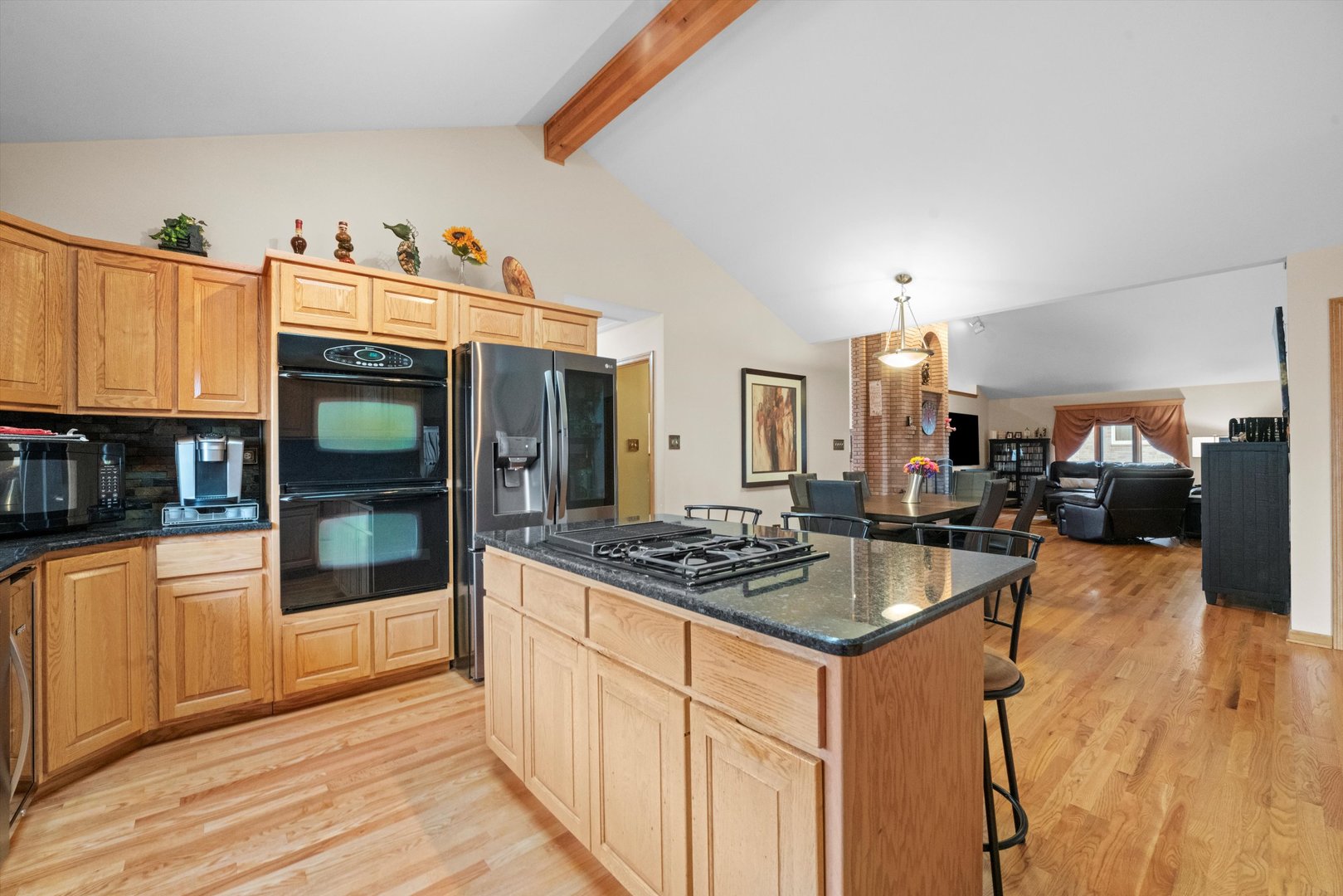 7428 Ridgefield Lane Tinley Park, IL 60487 - Photo 15 of 43 a kitchen with stainless steel appliances granite countertop a stove and a refrigerator