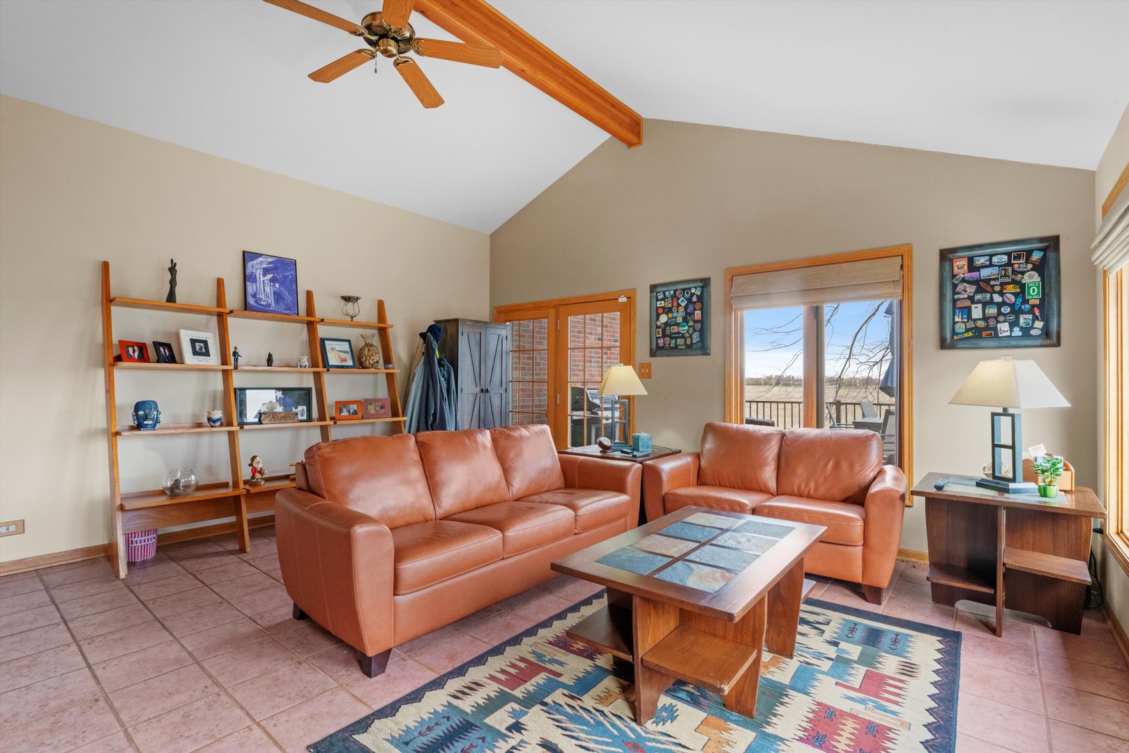 7428 Ridgefield Lane Tinley Park, IL 60487 - Photo 18 of 43 a living room with furniture a rug and a bookshelf