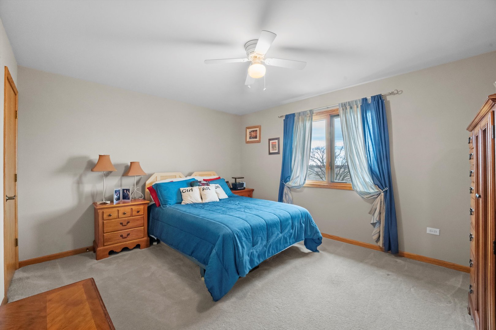 7428 Ridgefield Lane Tinley Park, IL 60487 - Photo 27 of 43 a bedroom with a bed and a chandelier