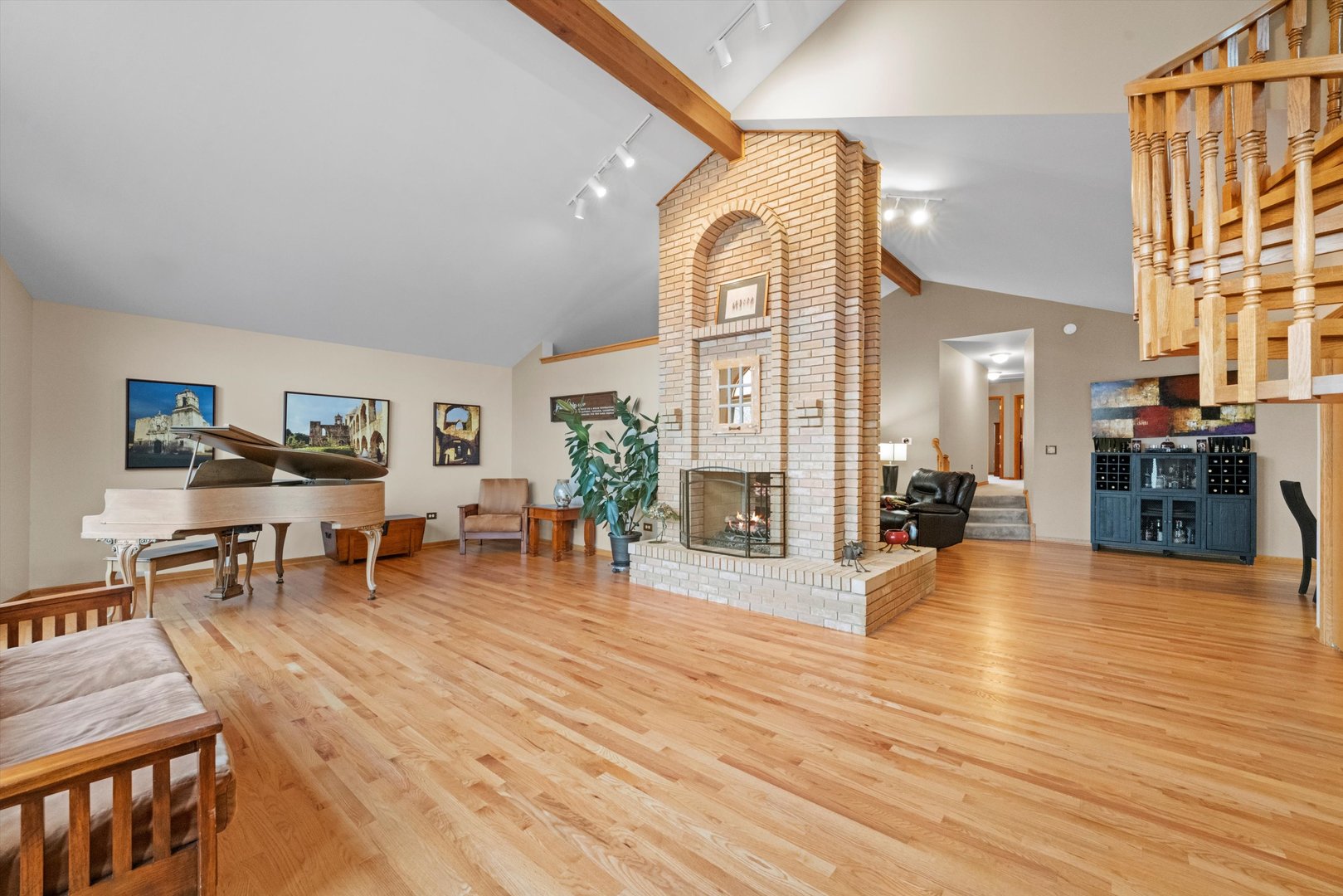 7428 Ridgefield Lane Tinley Park, IL 60487 - Photo 4 of 43 a living room with furniture a wooden floor and a large window