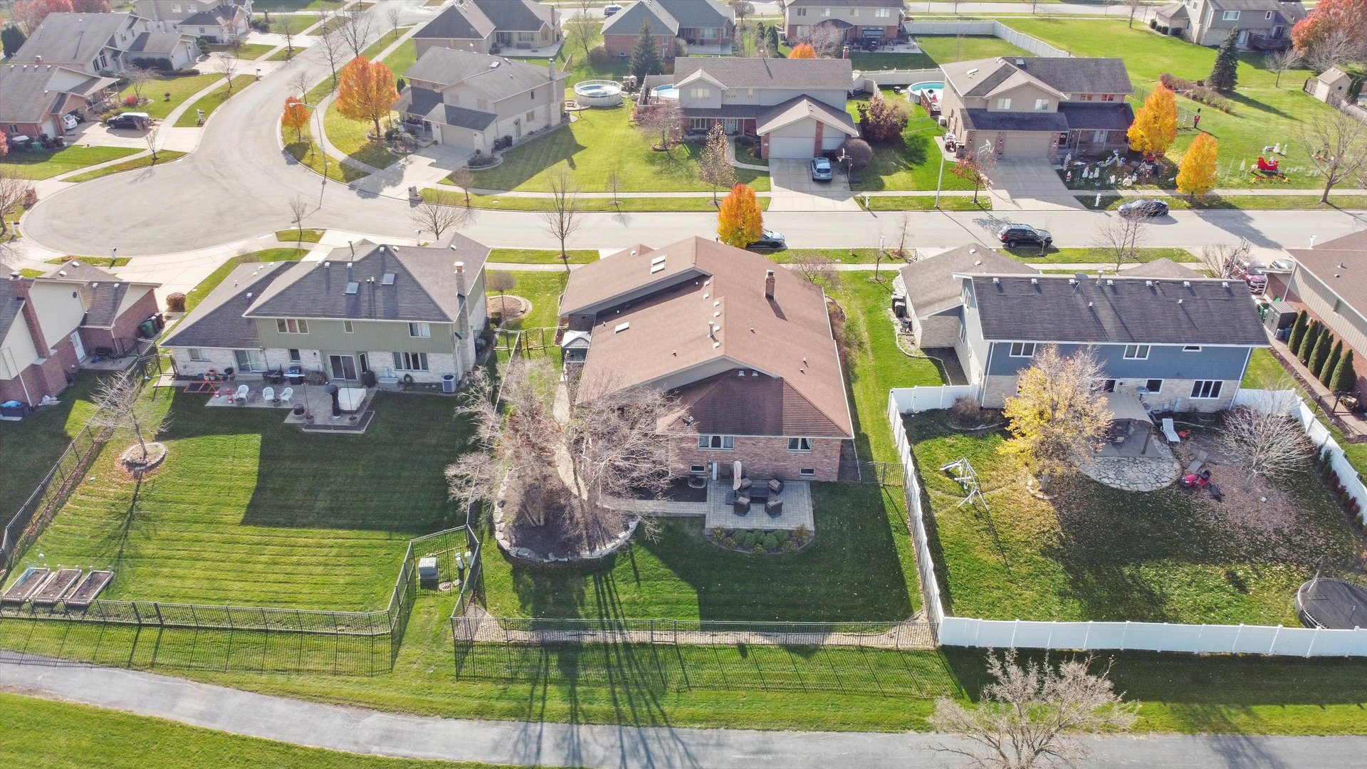 7428 Ridgefield Lane Tinley Park, IL 60487 - Photo 41 of 43 a view of houses with an outdoor space