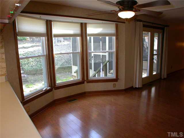 4524 Wingate Drive Raleigh, NC 27609 - Photo 12 of 25 a view of an empty room with wooden floor and a window